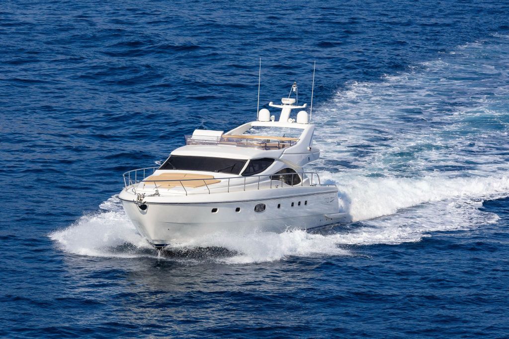 Side view of the elegant Ferretti 591 yacht on the water